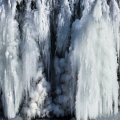Frozen waterfall with a cloud of diamond dust – a delicious phenomenon of the winter salmon